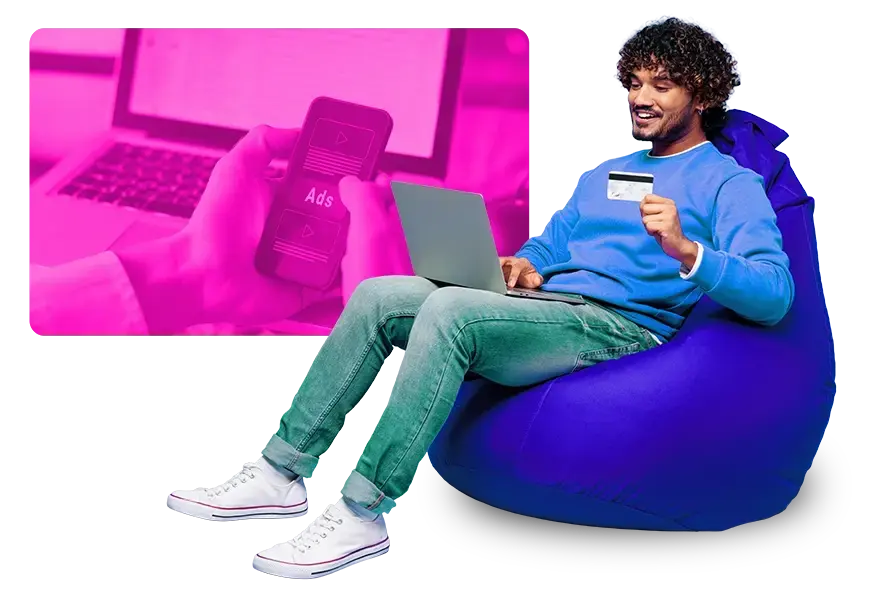 man sitting on a bean bag chair while shopping online